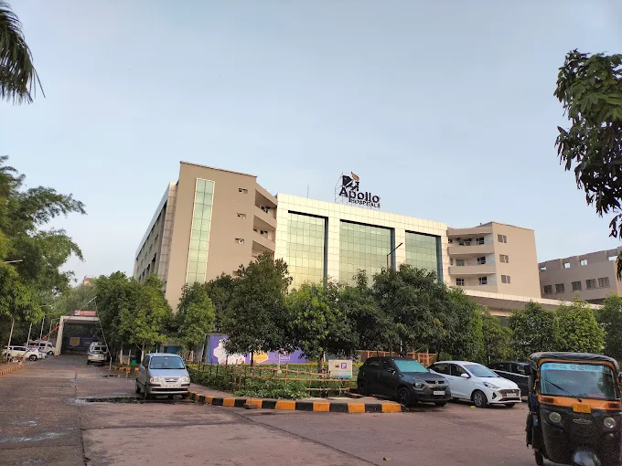 Apollo hospital bhubaneswar - front view of the hospital building with parking area