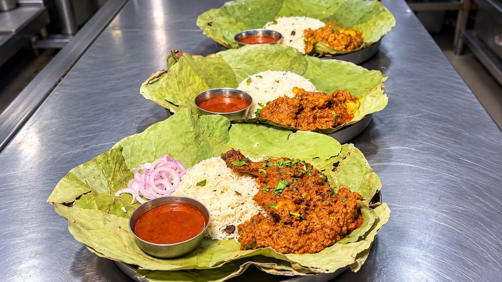 Traditional Bagara rice platter with chicken curry